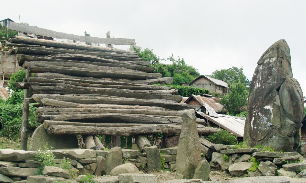 One of the wooden sentry stages with the ‘anointed’ stone at its base at Zhavame Village.(Morung Photo/Kuzhovesa Soho)